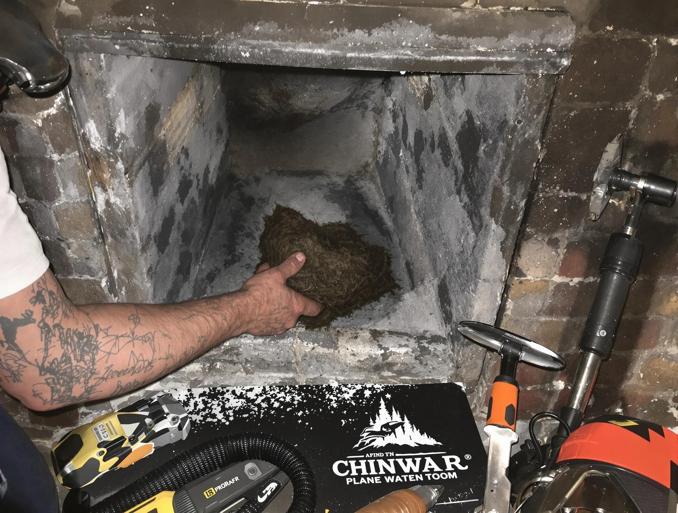 Clarkstown Chimney Sweep safely removing debris and screening chimney in Clarkstown, NY
